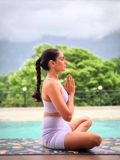 Finding stillness by the water. My practice is a journey of connecting with myself and with nature, a principle I bring into every session I guide, whether it's by a pool or in the studio.
