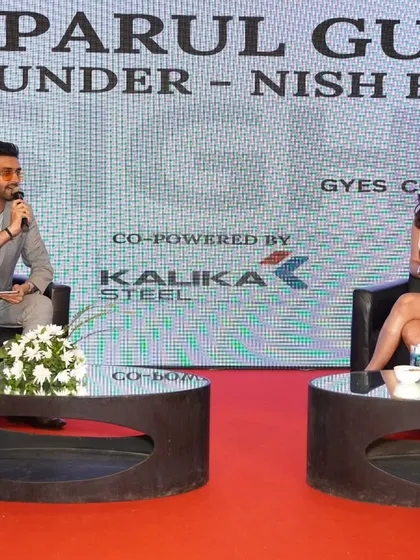 A wide view of my fireside chat with Parul Gulati at the Global Youth Economic Summit. The setup is designed for an intimate conversation, and my moderation style complements that.