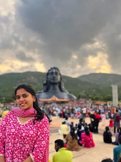 A traveler at the Adiyogi statue, a key highlight of our one-day spiritual trips.