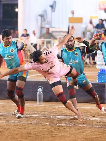 One of our raiders mid-air, attempting a jump touch to evade the defenders.