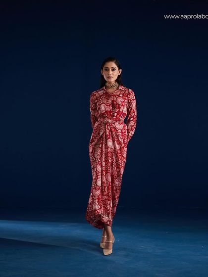 A full-length shot of the Aapro Rosela Draped Skirt Set, demonstrating the garment's flow and form.