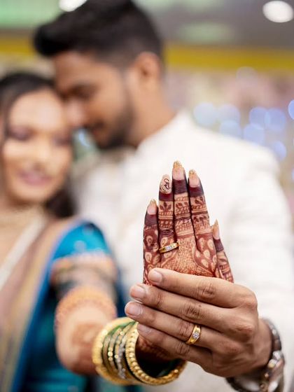 The bride proudly shows off her engagement ring, a beautiful detail shot that tells a big story.