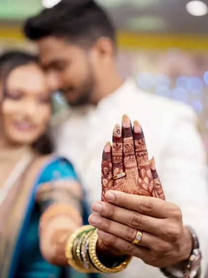 The bride proudly shows off her engagement ring, a beautiful detail shot that tells a big story.
