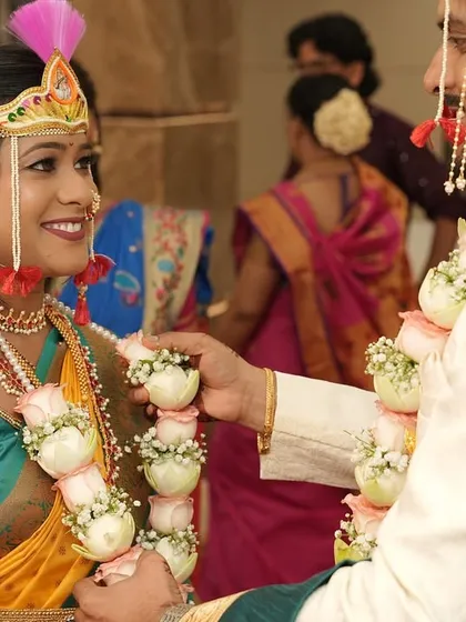 The Varmala ceremony is a key moment. The bride's makeup is set to perfection to ensure she looks stunning as she exchanges garlands with the groom.