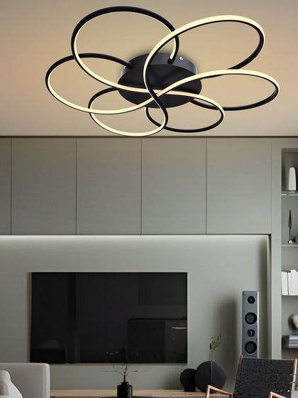 In this living room, the floret chandelier is the main source of light. Its sculptural form makes it a centerpiece, and the LED light is energy-efficient for everyday use.