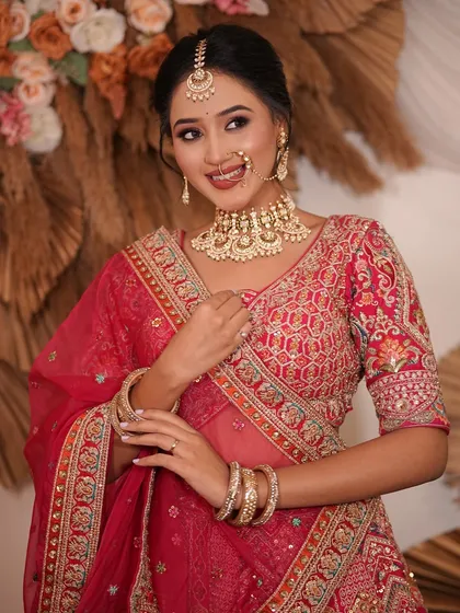 Another shot of the model, this time with her hand near her face, drawing attention to the intricate details of her jewellery.