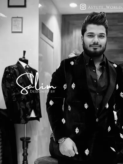 A client wearing a black velvet double-breasted blazer with crystal motifs. The double-breasted cut is a classic style that I've updated with modern details.