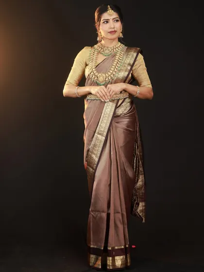 A direct, full-length view showing the complete look. This type of shot is essential for portfolios, clearly presenting the saree, blouse, and full jewellery set.