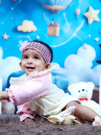 A cute crawling pose from the birthday girl during her teddy bear themed session.