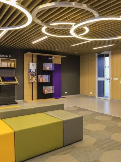 An interactive zone in the Oriflame office with digital terminals and modular seating. We created a dynamic and colorful space for training, presentations, and collaborative work.