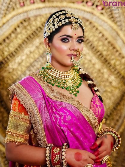 A full view of the stunning bridal ensemble, showcasing how makeup, hair, and outfit come together to create a cohesive and royal look.
