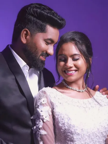 A happy couple posing together after their Christian wedding. The bride's makeup is soft and radiant.