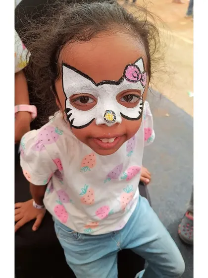 Here's a super cute Hello Kitty full-face design. I focus on clean lines and the signature pink bow to bring this adorable character to life for your little one's special day.