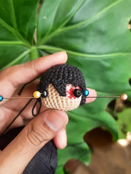 A little behind-the-scenes look at the Zuko head in progress, with pins holding the eyes in place before they're secured. It shows a bit of the careful process behind each piece.