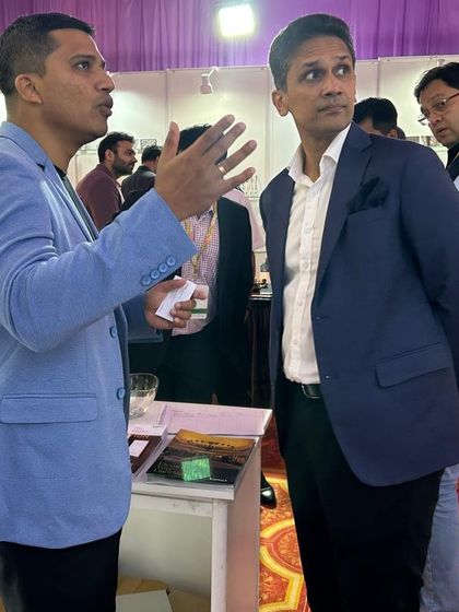 A moment of deep discussion at the FHRAI convention. Our team explains the technical and aesthetic benefits of our hotel automation systems to an interested hotelier.