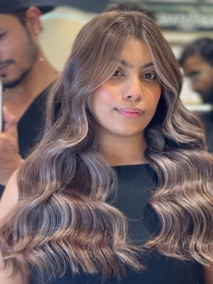 A detailed shot of the icy blonde color. You can see the intricate blend of cool blonde and silver tones that give this look its unique, high-fashion feel.