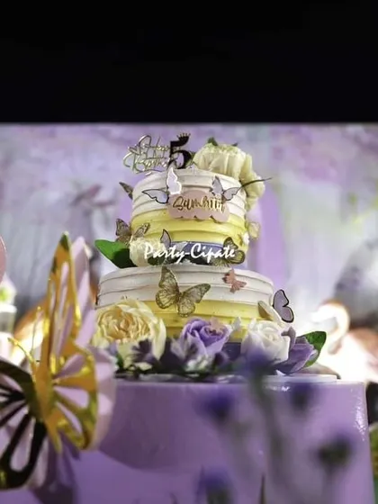 The birthday cake is always a showstopper. This stunning five-tiered cake, adorned with delicate butterflies, was the centerpiece of the dessert table at this magical fairy party.