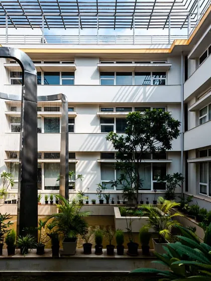 The central courtyard of our LEED Platinum certified office in Noida. The space is designed around a water body that acts as a natural heat sink, passively cooling the building and creating a tranquil heart for the workplace. This is how we build spaces that breathe.