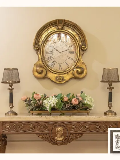 This vignette captures the essence of my collection. The French Regence console, paired with a vintage wall clock, elegant lamps, and a beautiful floral arrangement, creates a warm and sophisticated atmosphere that feels both curated and inviting.