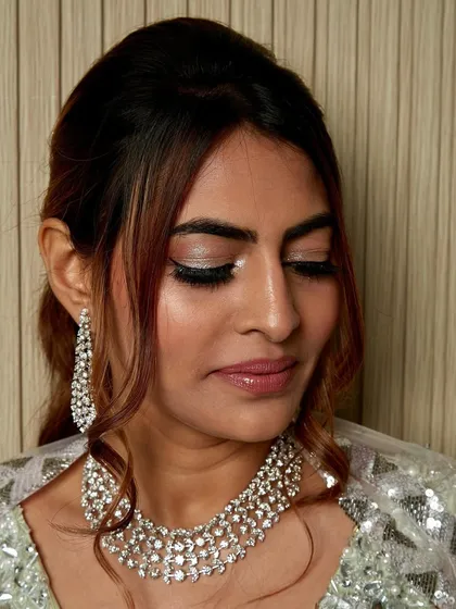 You can never have too much shimmer. This close-up shows the stunning silver glitter eyeshadow I used for this reception look. It's all about bold, beautiful sparkle.