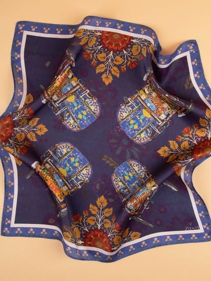 A flat-lay of a navy blue pocket square with a unique auto-rickshaw print, showcasing the full design.