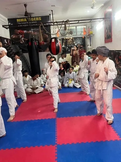 A full class practicing their fundamental stances. A strong stance is the base for every block, punch, and kick. We drill this relentlessly.