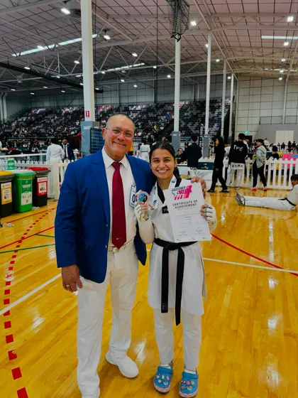 Our athlete Sonia with an official at the WT President's Cup, a moment of pride and recognition.