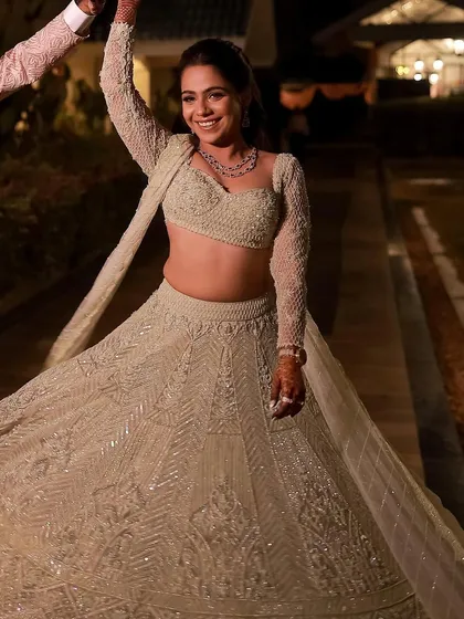 Makeup should feel so good you can't help but dance. This candid shot captures the pure joy of a client at her sangeet, with a luminous look that stays flawless all night long.