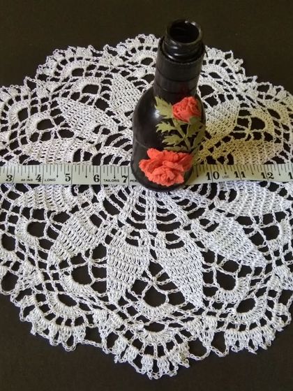 Showing the scale of the 15-inch flower doily.