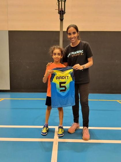 A big welcome to Aadit! Here he is with his coach and his new jersey, ready to start his basketball journey with us.