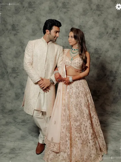 A stylish couple poses during their wedding festivities. Our catering is designed to match the elegance and personal style of our clients, ensuring a cohesive and sophisticated event.