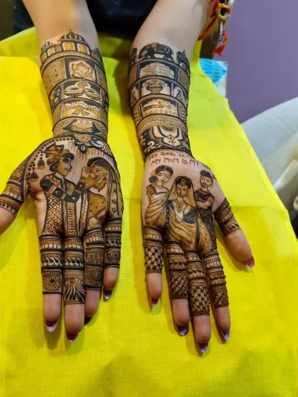A tribute to family. This custom mehandi includes portraits of the bride's parents on one hand, with the message "My Mom is My Hero," and the couple on the other.