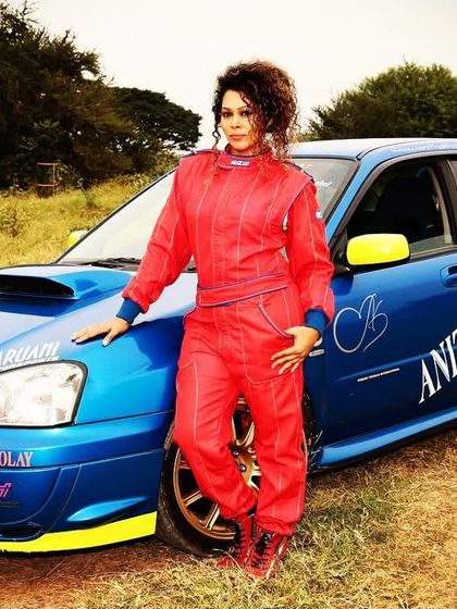 Our founder, Anitha Kholay, with her iconic Subaru rally car. Her passion and experience in professional rallying are the foundation of our motorsport academy.