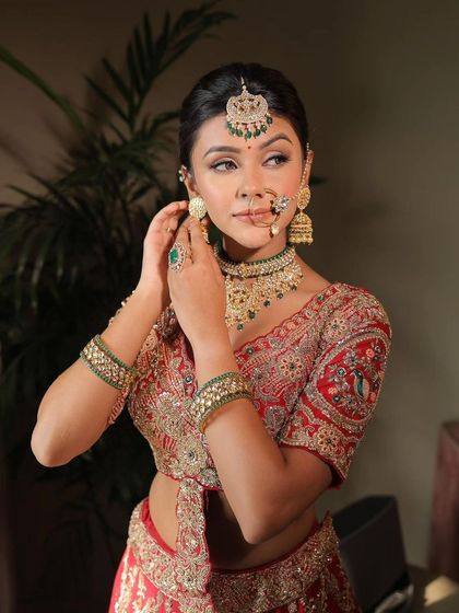 A wedding guest getting ready. This candid shot shows the final touches being put on her beautiful, traditional look.