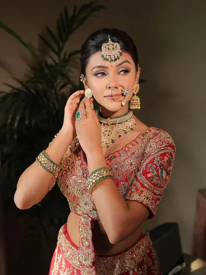 A wedding guest getting ready. This candid shot shows the final touches being put on her beautiful, traditional look.