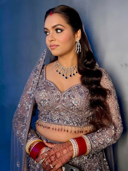 A close-up of the subtle shimmer and sculpted skin for this reception look. The smokey eye is blended to perfection for a sophisticated finish.