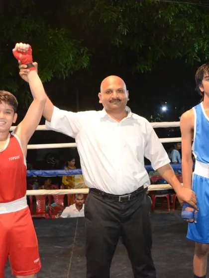 The referee raises the winner's hand. A familiar sight for our academy's fighters.