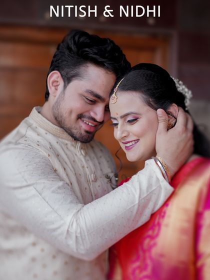 A close, candid-style portrait of a couple in traditional attire. This type of shot is great for capturing the genuine affection and happiness during an engagement or family function.