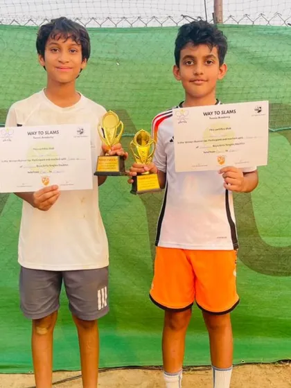 Reyansh Gandhi and his partner Arya Singh Bisht as runners-up at the Boys U12 Doubles final of an AITA Championship Series tournament.