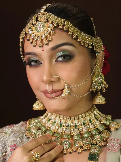 A close-up portrait that captures the flawless finish and rich colors of this bridal look.