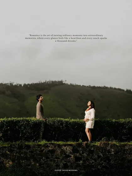 A wide, scenic shot of the couple amidst the rolling hills of a tea plantation, creating a sense of peace and solitude for their pre-wedding story.