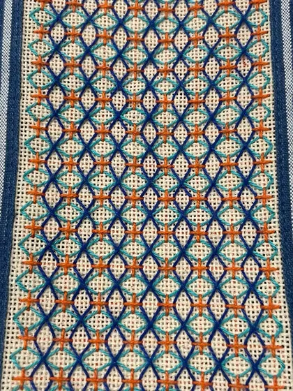This custom phone insert features a geometric design with pops of orange, creating a striking contrast against the blue.