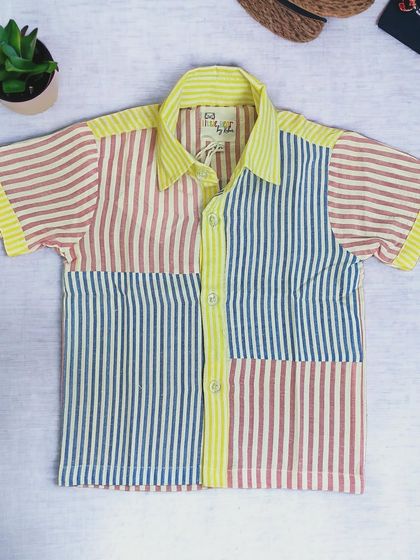 Cool in every stripe! This pastel multi-color striped shirt is perfect for summer adventures. It's light, breathable, and has such a fun, playful vibe.