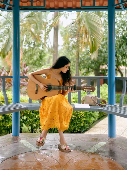Finding a quiet spot in a park with my guitar is my happy place. This is where I often sit to brainstorm lyrics and melodies, inspired by the stories people share with me for their unique songs.
