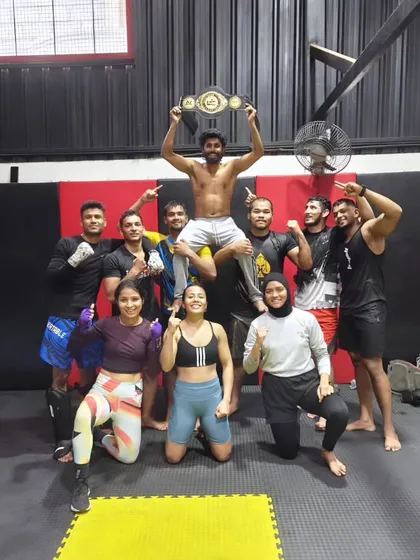 This is what our team is all about. We celebrate every victory, big or small, like family. Here we are lifting up our newly crowned champion, Shahid, after his incredible win. When you join us, you join a legacy of fighters.