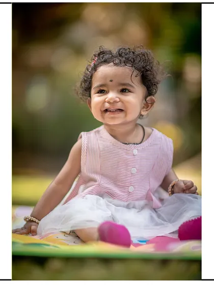 And here is her beautiful, toothy grin. I aim to deliver a gallery that shows the full range of your child's expressions.