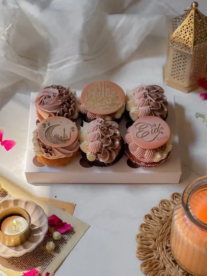 A box of six beautiful Eid-themed cupcakes, with delicate piping and toppers featuring crescent moons and Eid greetings. These are a perfect sweet for sharing during Iftar.
