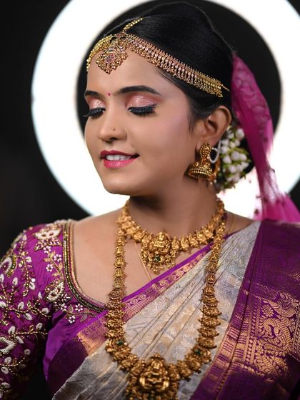 A close-up of Disha's reception makeup, with the ring light creating a perfect halo. This shows how I use professional lighting to ensure a flawless application.