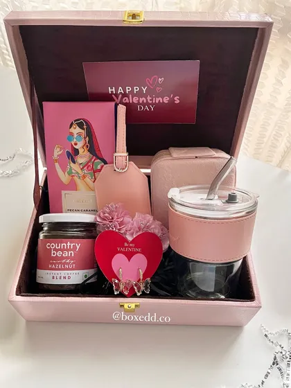 For Valentine's Day or any romantic occasion, I curate hampers that are all about thoughtful luxury. This pink leatherette trunk is filled with handpicked goodies for her, making it a truly special gift.