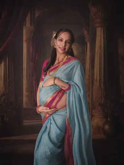 Tradition holds so much beauty. This portrait, inspired by classic paintings, blends the elegance of a traditional saree with the timeless story of motherhood, creating a true heirloom image.